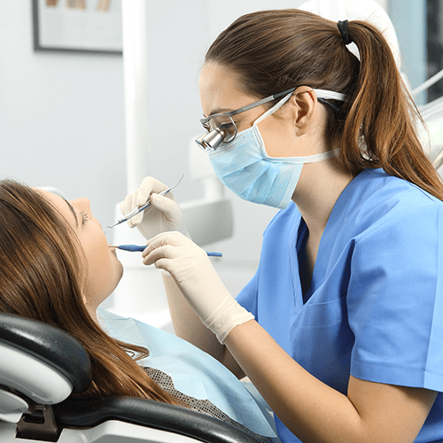 Woman is at dentist's office for appointment.